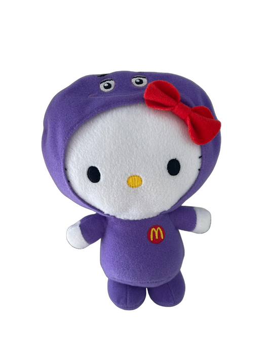 Plush toy with a purple outfit and red bow on a white background hello kitty mcdonals