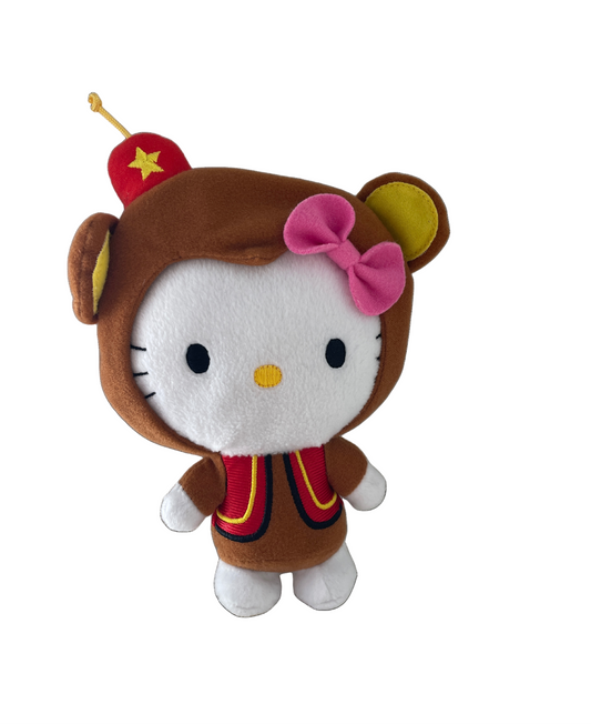 Plush toy resembling a character with a brown outfit, red hat, and pink bow on a white background hello kitty mcdonalds